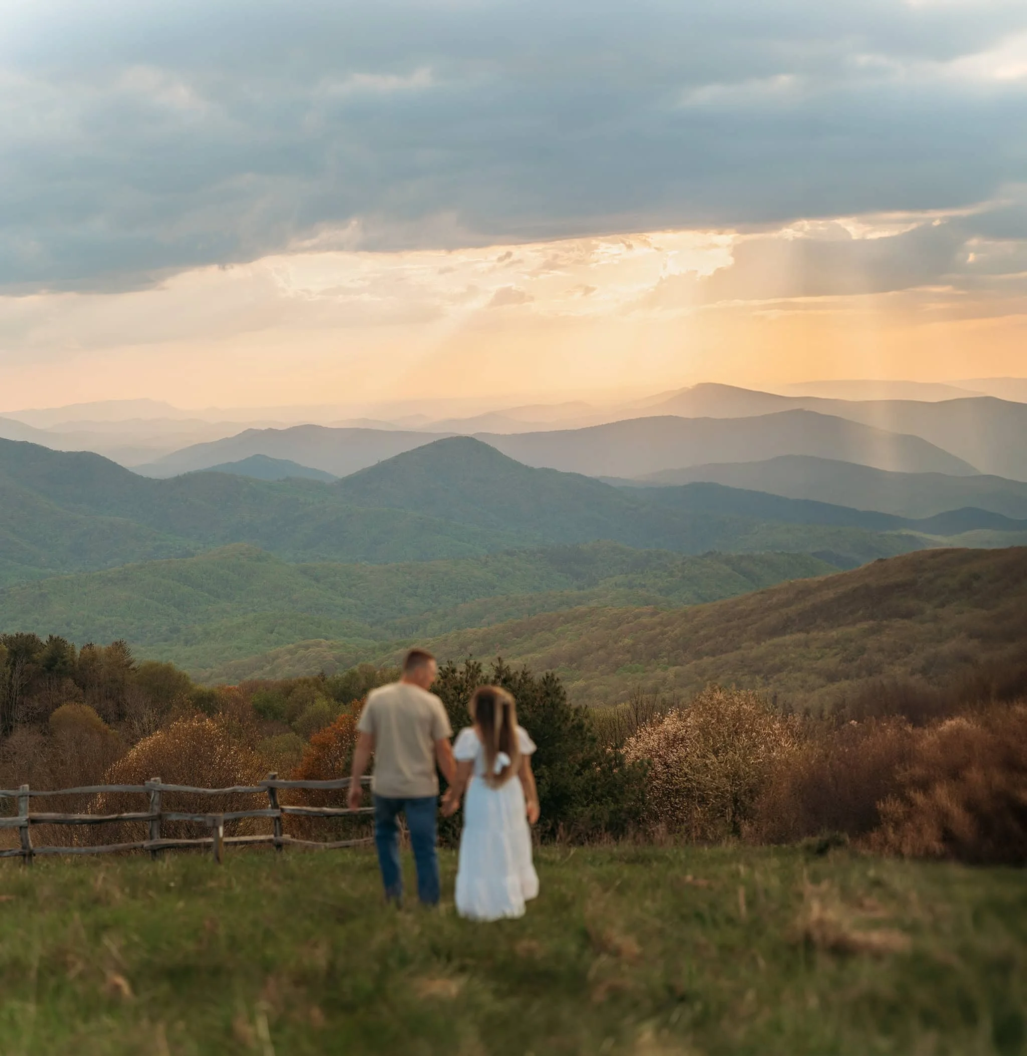 Sunset Proposal in the Great Smoky Mountains Couple standing together at sunset overlook in the Great Smoky Mountains during romantic proposal moment