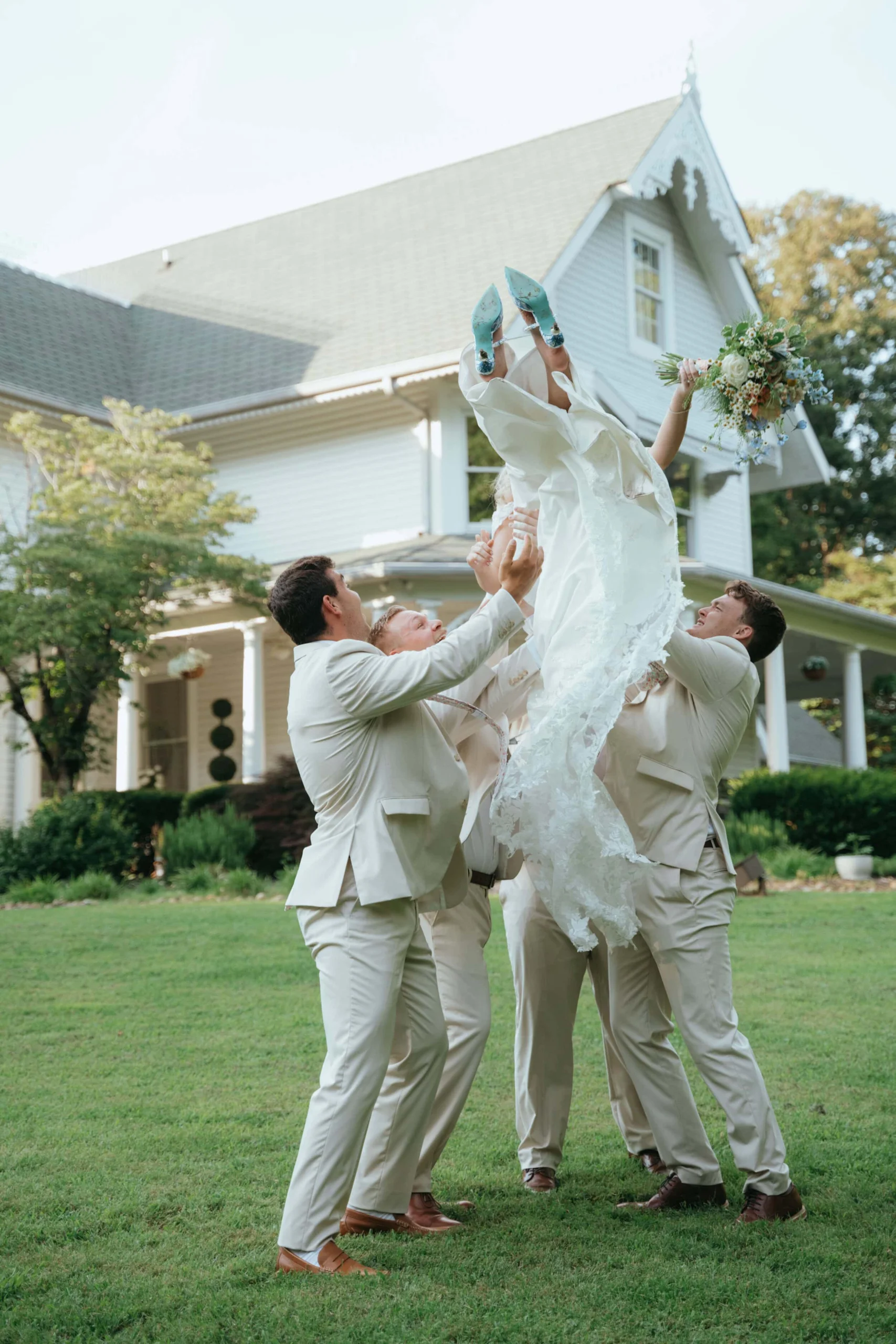DSC03194 Joyful wedding party celebrating outside at The Grand Victorian in Tennessee