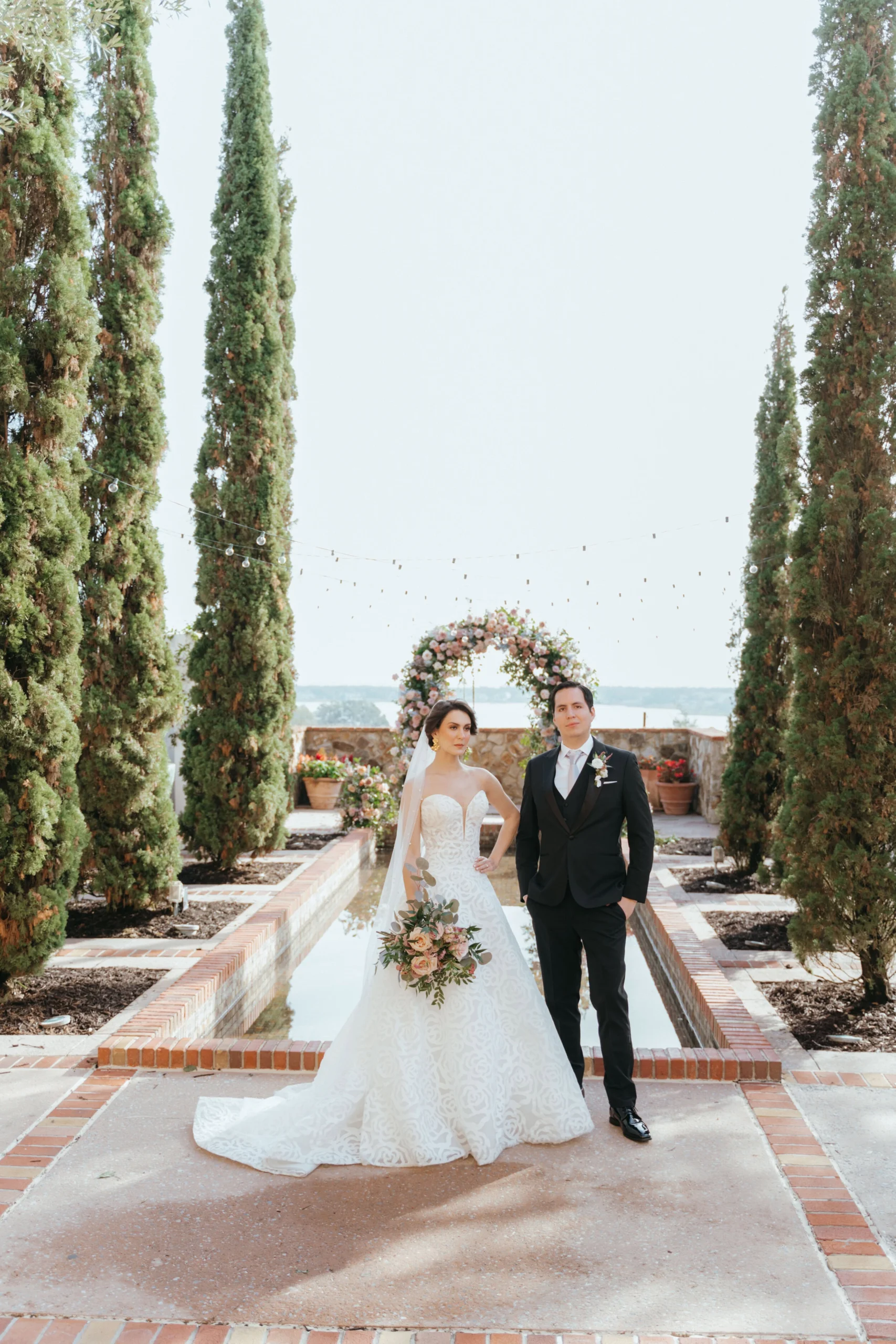 bridal portrait at Bella collina wedding Bride and a groom posing for editorial portrait while guests are enjoying some drinks