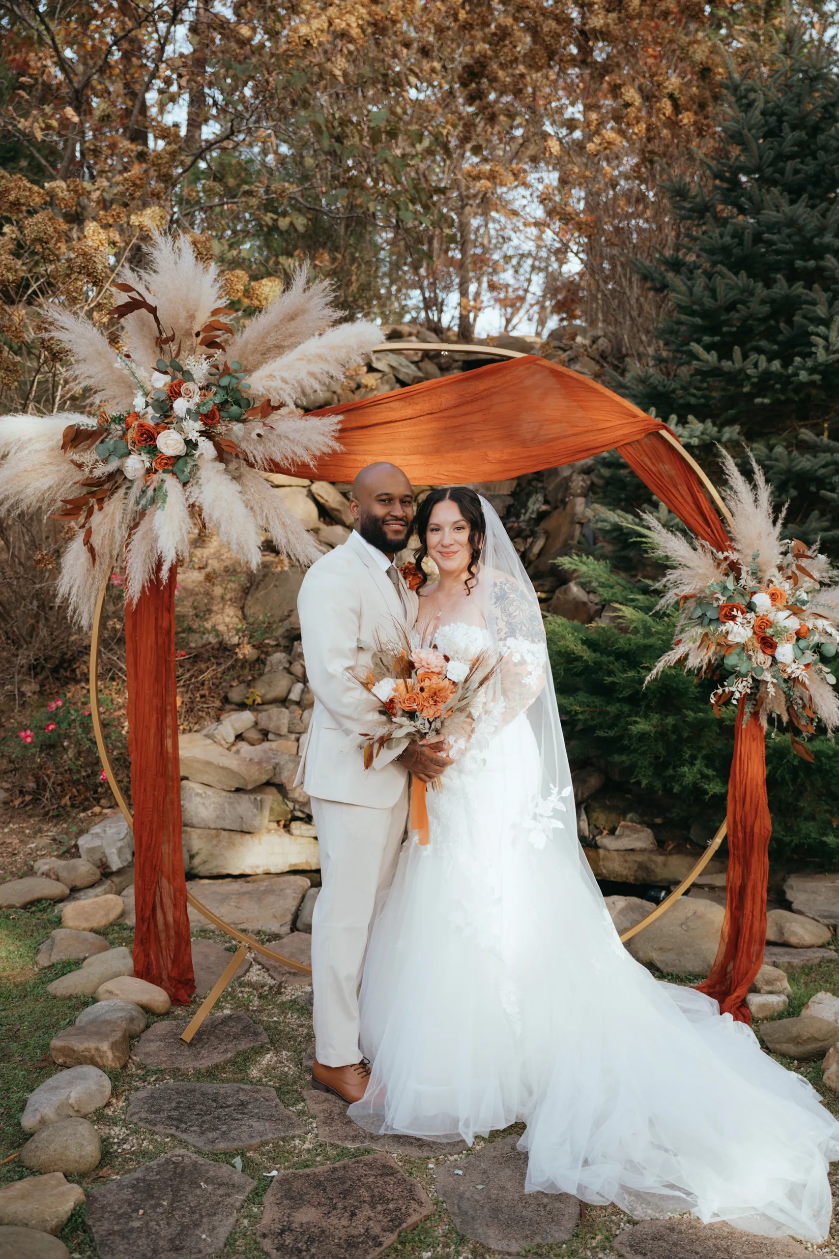 Couple is taking bridal photos during their fall wedding in the Smokies