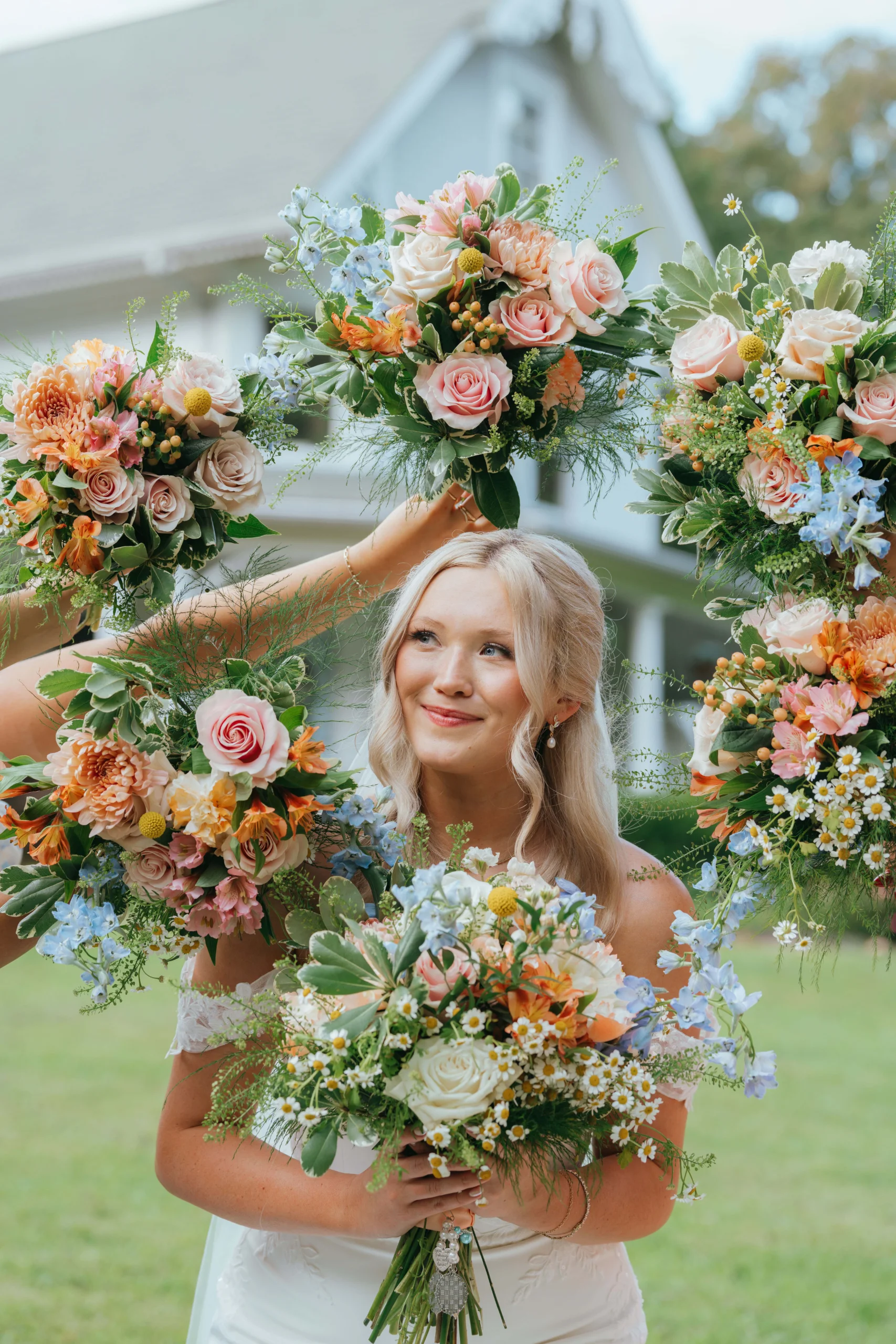 Elegant summer wedding decor in blue yellow and pink at Knoxville Tennessee venue, bridal portrait with wedding flowers