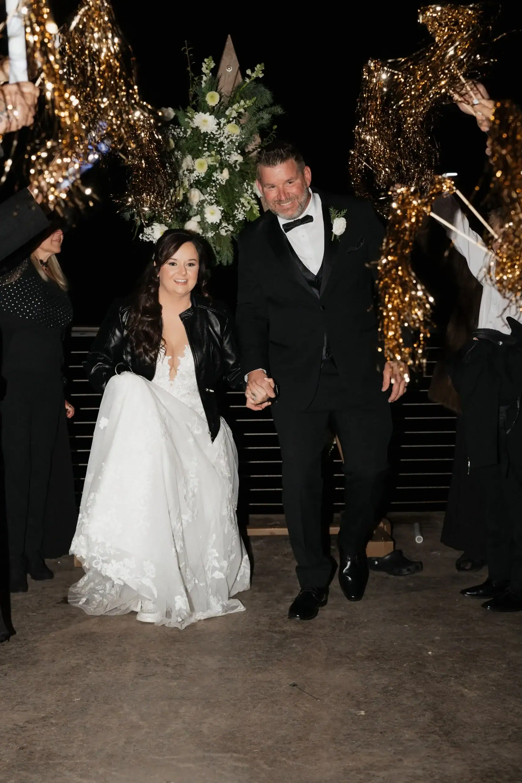 creative wedding exit at Magnolia using Tinsel wands gold