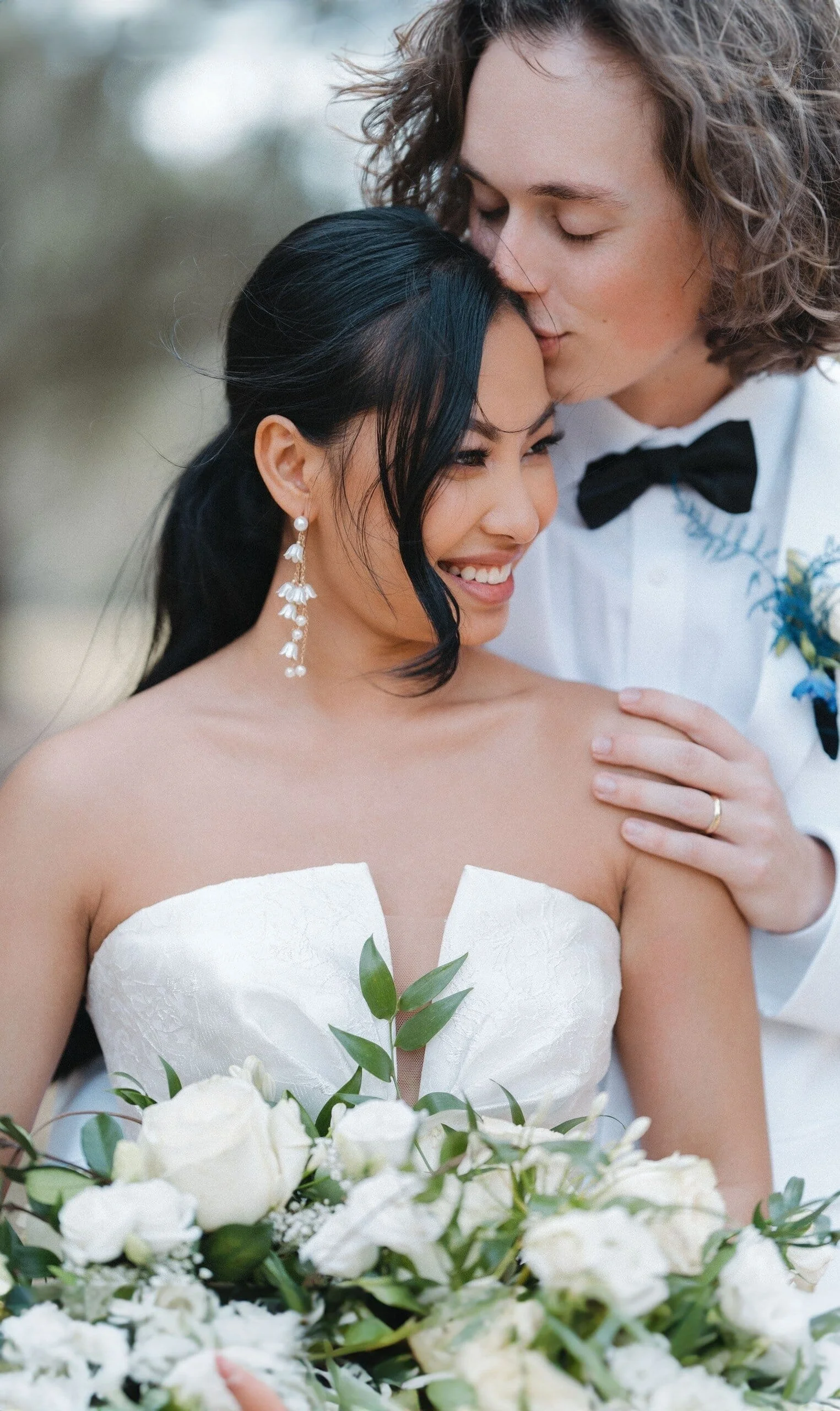 happy bride during weeding day. Bride smiling during wedding morning getting ready moments captured by Knoxville wedding photographer Gulnaz Graves